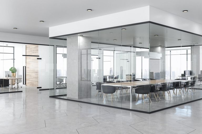 Contemporary glass concrete office interior with city view, daylight, furniture and equipment. 3D Rendering